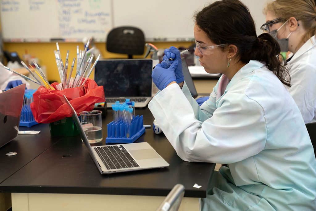 A student marks a sample.