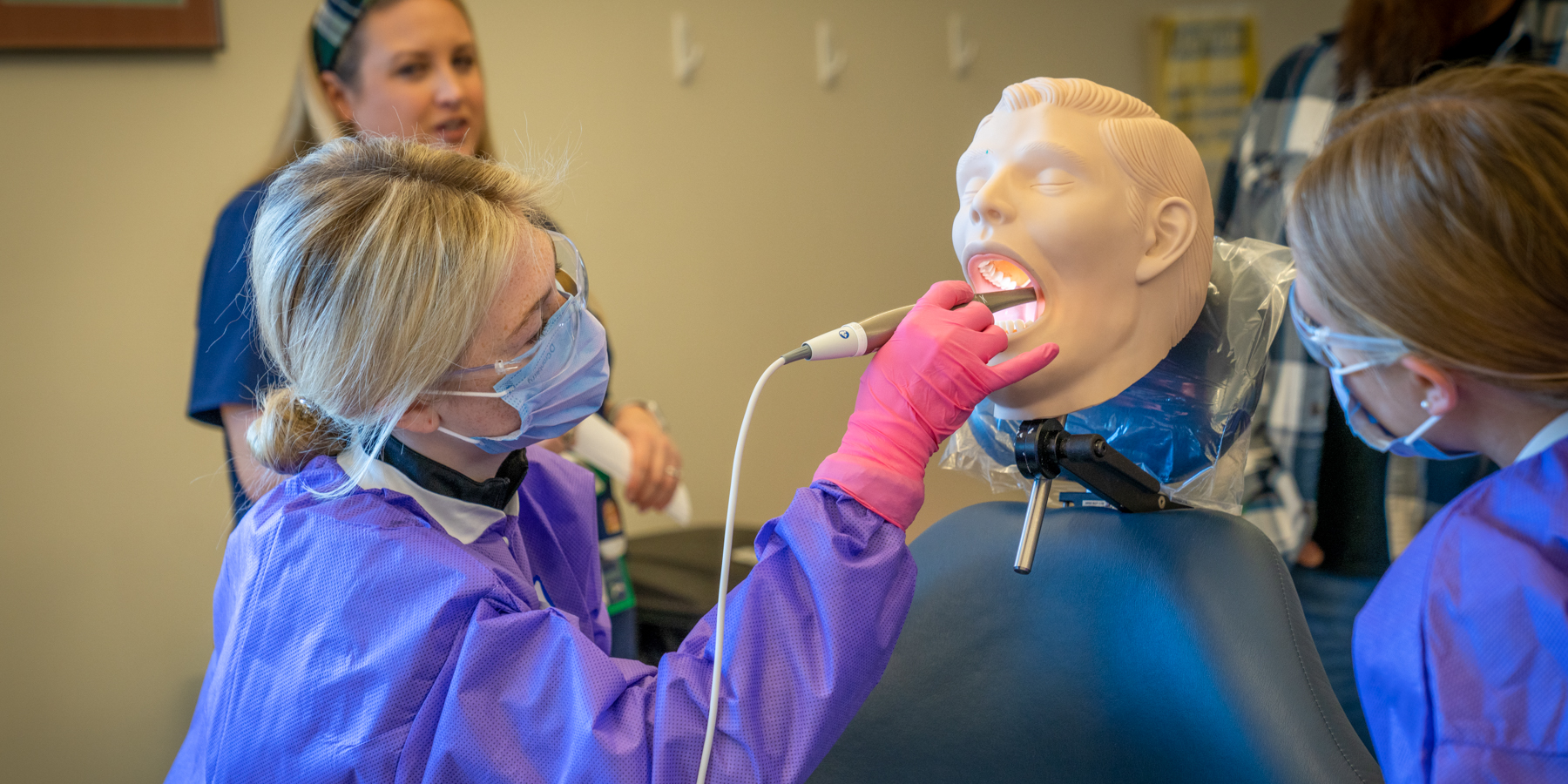 Student using an intraoral camera.  