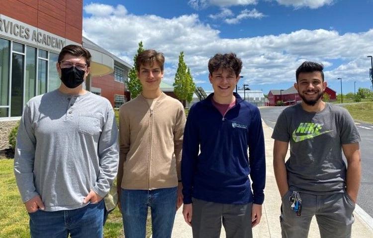 From left, Christopher Morency, 18, of Danvers, stands with fellow Essex Tech students Nathan Hammerschmitt Le Gal, 17, of Lynn, Thomas Politano, 18, of Lynn, and Ali Alkinani, 19, of Beverly, outside of the school. Hammerschmitt Le Gal and Politano will become the first Essex Tech students to attend Ivy League colleges this fall, while Morency and Alkinani have found successful careers in the trades.